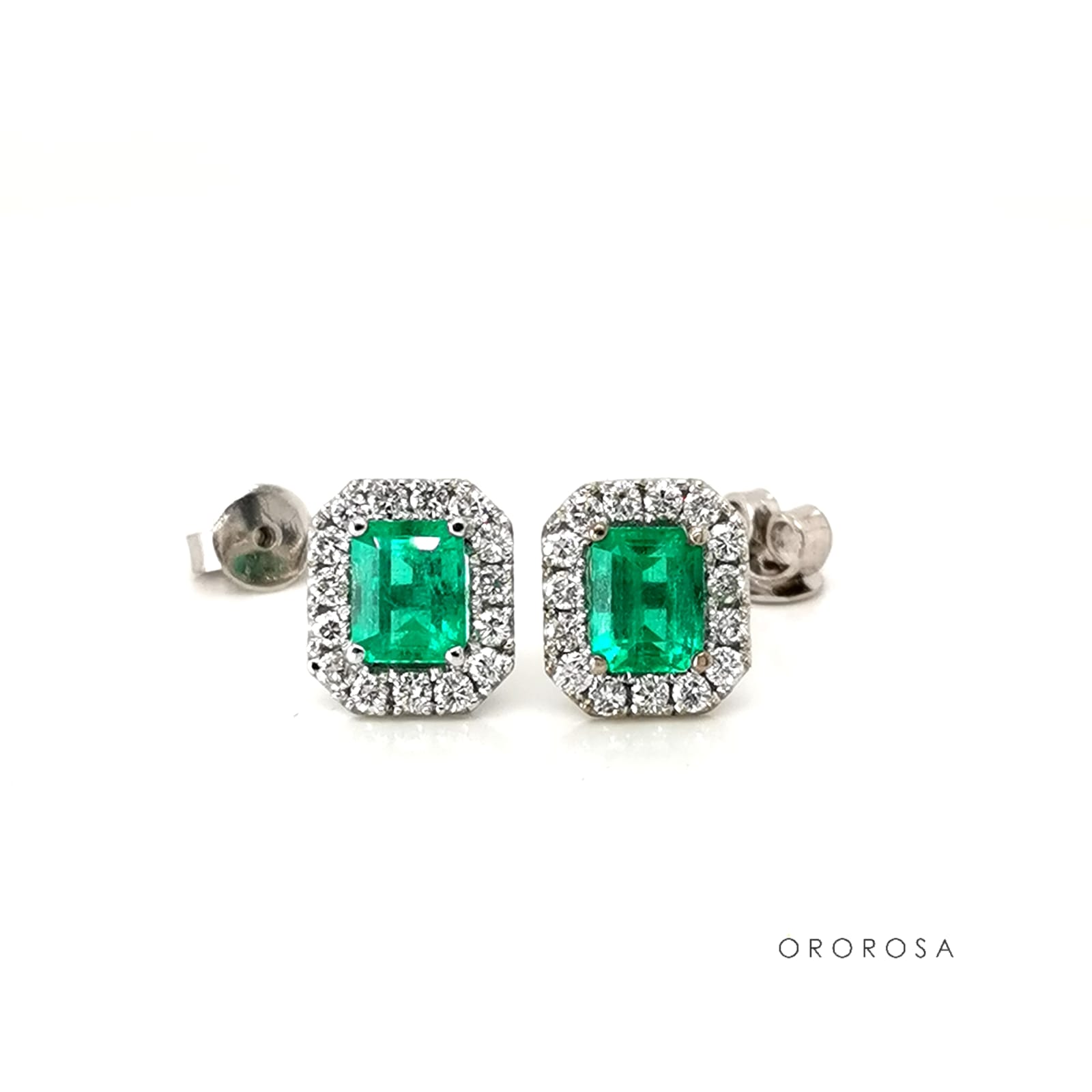 Aretes esmeralda y halo de diamantes